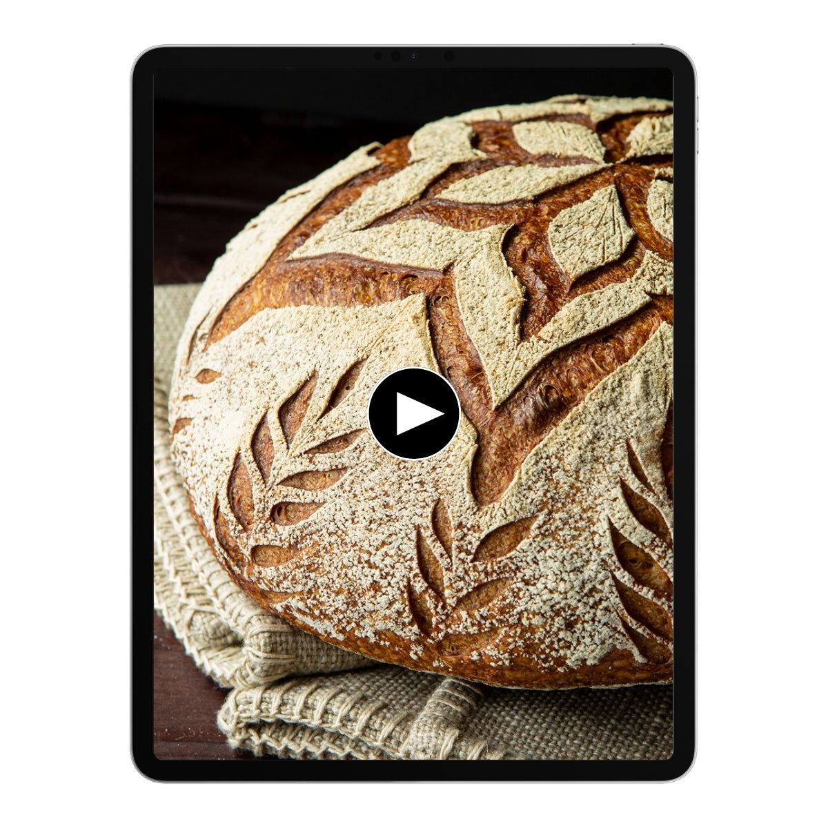 Brot mit Blumenmuster auf einem Tablet