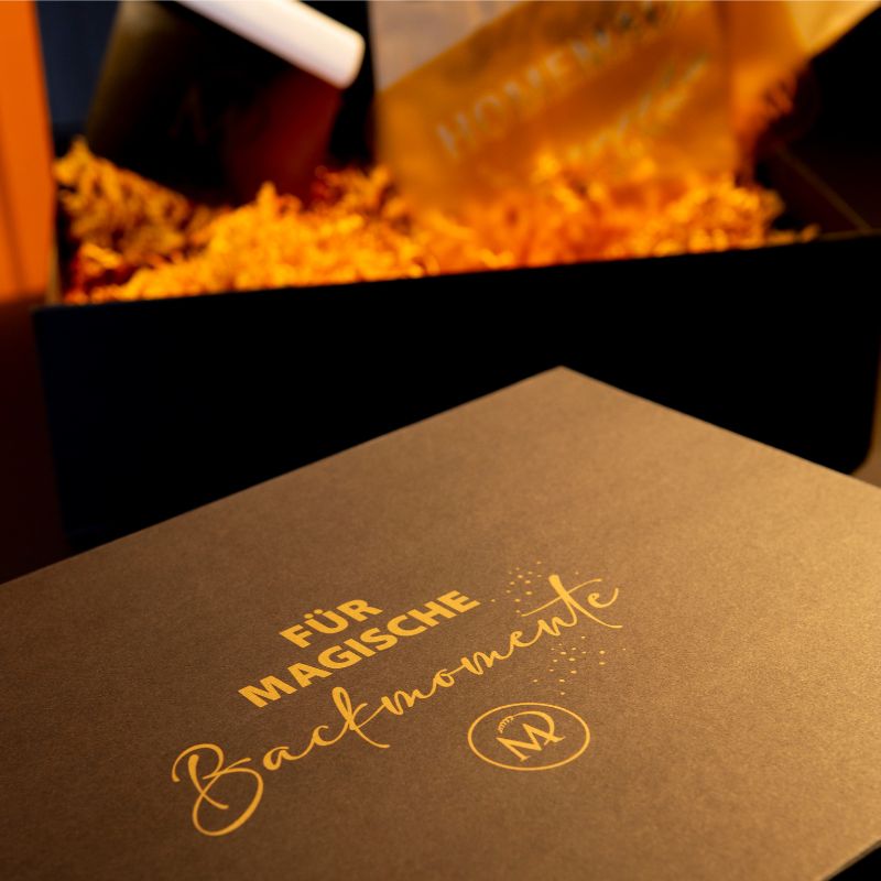 Geschenkbox mit Aufschrift „Backmomente“